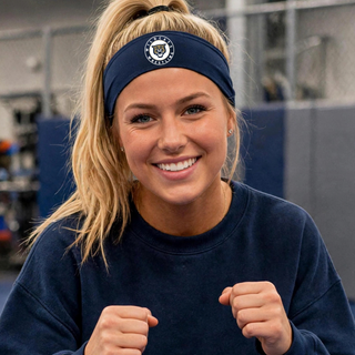 Model wearing a navy Topeka Wildcats Wrestling Club Circle Logo PosiCharge headband