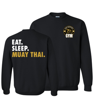 Black Gildan crewneck sweatshirt featuring Eat Sleep Muay Thai back print in white and gold with Iron Warriors Gym lion logo on front chest