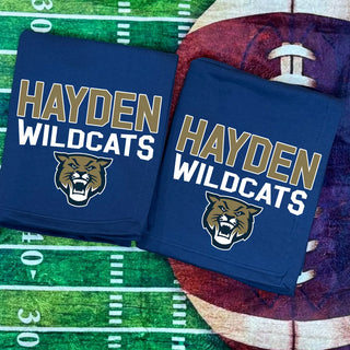 Navy Hayden Wildcats stadium blanket featuring bold gold and white Hayden Wildcats text with wildcat mascot logo, displayed on football field background