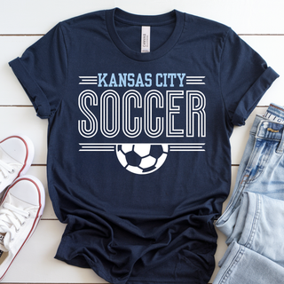 Navy Bella Canvas shirt with Kansas City Soccer stripe graphic and white soccer ball design