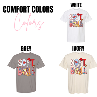 Softball graphic top available in Comfort Colors brand shown in white, grey, and ivory with red, blue, and yellow softball themed design.