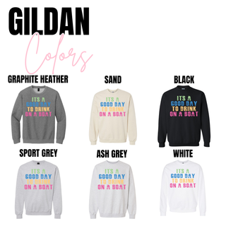 Gildan top featuring the Good Day To Drink On A Boat graphic with distressed multicolor block lettering in green, blue, mustard, and pink, shown in ash grey, white, graphite heather, sport grey, black, and sand color options.