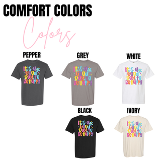 Comfort Colors shirt in pepper, grey, white, ivory, blossom, chalky mint, chambray, neon pink, violet, and orchid with It’s a Good Day to Be Happy retro graphic