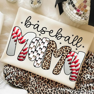 Baseball Lace Mama Graphic Top on ivory garment featuring script baseball detail and oversized MAMA lettering with red baseball lace stitch texture and leopard print accents