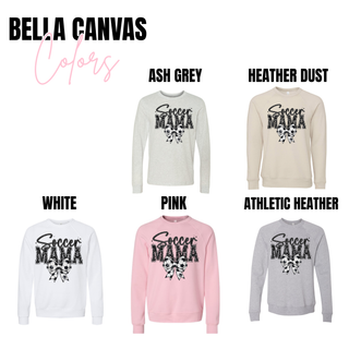 Soccer Mama faux glitter bow graphic Bella Canvas top available in ash grey, heather dust, white, pink, and athletic heather featuring distressed black lettering and soccer ball bow graphic.