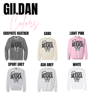 Soccer Mama faux glitter bow graphic Gildan crewneck shown in graphite heather, sand, light pink, sport grey, ash grey, and white color options with distressed varsity lettering and soccer bow detail.