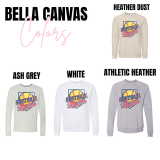 Bella Canvas softball mama graphic top shown in heather dust, ash grey, white, and athletic heather. The graphic includes a bright yellow softball backdrop with navy Softball text and red Mama script across the center inside a vintage inspired framed layout.