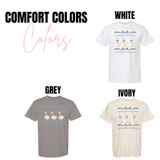 Vintage three geese bow graphic Comfort Colors top shown in white, grey, and ivory featuring three white geese with blue bows, ribbon accents, and subtle decorative border elements.