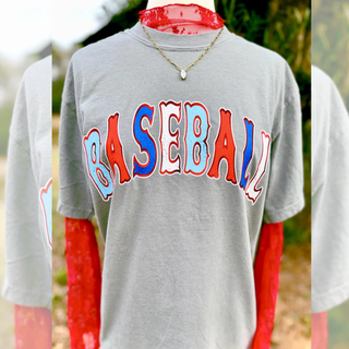 Vintage bold Baseball lettering graphic top shown on model in grey featuring oversized retro style red, white, and blue varsity inspired text across the chest.