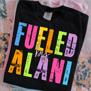 fueled by alani colorful graphic shirt on black comfort colors tee with bold distressed rainbow lettering
