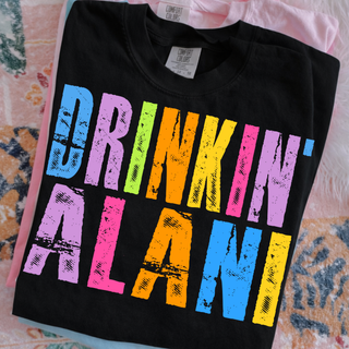 drinkin alani colorful graphic shirt on black comfort colors top with bright distressed lettering