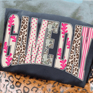 game day graphic top with leopard camo polka dot and checkered pattern lettering on dark shirt