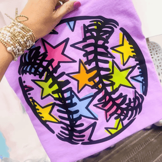 colorful star baseball softball graphic top on purple shirt with multicolor star ball design