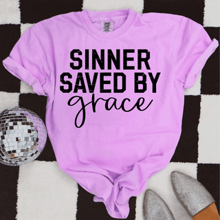 sinner saved by grace christian graphic top black text pink comfort colors tee