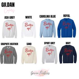 Batter up script graphic top displayed on Gildan apparel in crewneck and sweatshirt styles across neutral and blue tones
