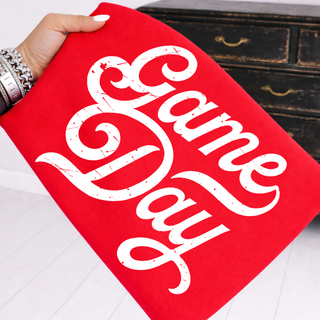 distressed game day graphic top with white vintage script lettering on red shirt