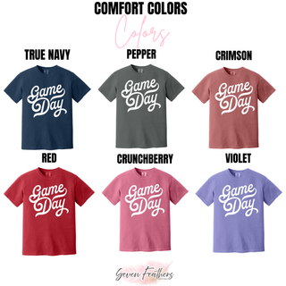 distressed game day graphic top shown on Comfort Colors shirts in true navy, pepper, crimson, red, crunchberry, and violet