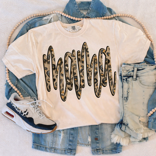 tall leopard mama graphic top styled with denim shorts sneakers and denim jacket flat lay