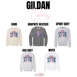 gildan 1776 patriotic graphic sweatshirt color options in sand, graphite heather, sport grey, ash grey, and white featuring bold 1776 red white and blue design with bow and star details