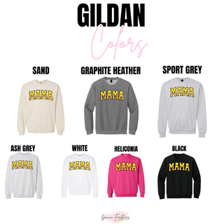 Gildan mama graphic top shown in sand, graphite heather, sport grey, ash grey, white, heliconia, and black crewneck options, all featuring bold yellow varsity “MAMA” lettering with pink softball stitch accents