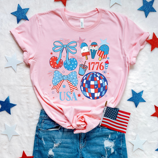 Pink USA 1776 patriotic bows graphic top with stars, fireworks, disco ball, and red white blue summer icons