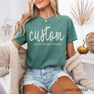 personalized custom name graphic tee in light green with script text and names underneath styled with cozy neutral cardigan