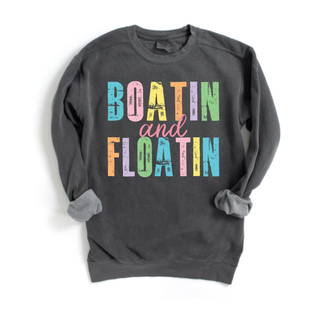 Pepper Comfort Colors Boatin and Floatin crewneck with multicolor distressed block letter design laid flat