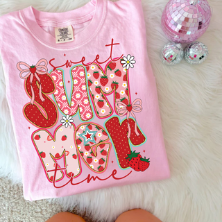 Sweet Summertime Strawberry Top in Blossom pink Comfort Colors tee with colorful patterned Summer lettering, strawberries, daisies, and bow accents, flat lay styled with pink disco balls