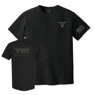 Black Comfort Colors tee showing sage ink Abbott Ranch pocket logo front and Kansas state outline logo on back