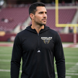 Man wearing black Adidas Silver Lake Eagles Football Apex lightweight quarter-zip hooded pullover at football field