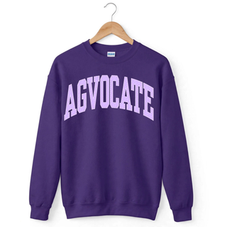 Agvocate Varsity Block graphic design in a lavender confetti pattern on a classic solid purple crewneck sweatshirt.