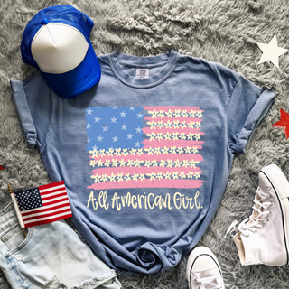 Blue jean Comfort Colors All American Girl tee styled flat lay with flag hat and sneakers