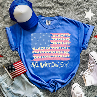 Flo blue Comfort Colors All American Girl tee styled flat lay with flag hat and sneakers