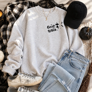 Ash grey crewneck with basic witch pocket design featuring witch on broom and bats