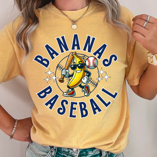 Woman wearing mustard yellow tee with Batter Up Banana Circle baseball graphic