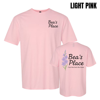 Light pink tee showing front and back with Bea's Place logo on chest and full gladiolus graphic with care that feels like home on back