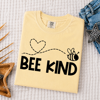 Bee Kind Heart Trail Comfort Colors tee in butter with heart and bee graphic above bold black lettering
