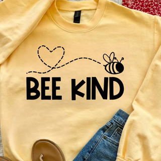 Bee Kind Heart Trail Gildan tee in yellow haze with heart and bee graphic above bold black lettering
