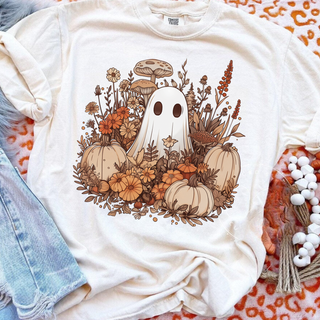 Comfort Colors ivory tee with boho ghost surrounded by pumpkins wildflowers and mushrooms in warm fall tones

