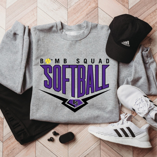 Bomb Squad Chevron Diamond softball logo top shown as a heather grey crewneck sweatshirt in a lifestyle photo