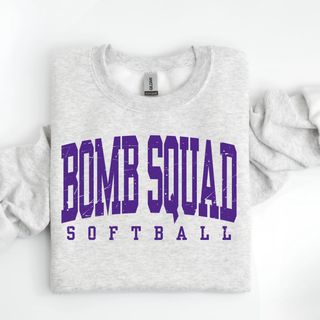 Bomb Squad distressed purple varsity softball graphic on a grey crewneck sweatshirt