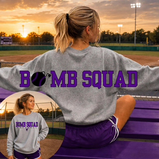 Woman wearing Bomb Squad Softball oversized back print sport grey crewneck at a softball field