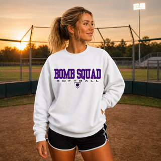 Woman wearing a White Bomb Squad Softball crewneck at a softball field