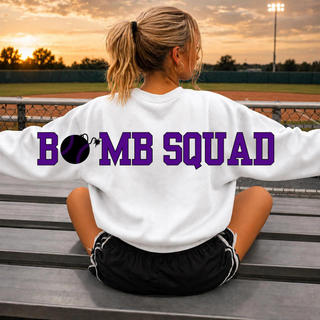Woman wearing Bomb Squad Softball oversized back print white crewneck at a softball field