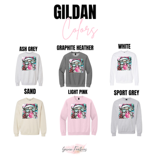 Gildan color chart showing the Highland cow Santa design in Ash Grey, Graphite Heather, White, Sand, Light Pink, and Sport Grey