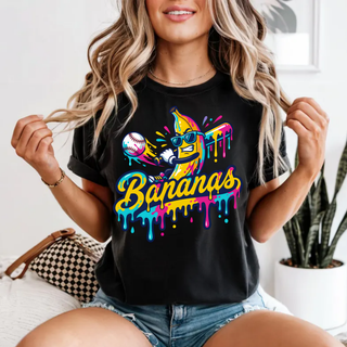 Black Comfort Colors tee with colorful neon drip banana mascot in sunglasses design worn by model