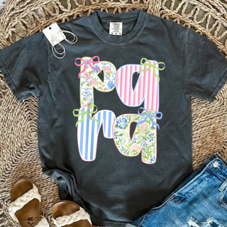 Pepper tee laid flat with para in large coquette patchwork floral stripe letters with ribbon bows on each letter
