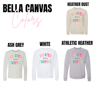 Bella Canvas color chart for Created With A Purpose top showing Heather Dust, Ash Grey, White, and Athletic Heather crewneck sweatshirts and long sleeves