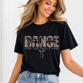 Woman wearing black top with leopard print dance every step tells a story graphic and bow design