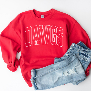 Red crewneck sweatshirt with bold white outlined DAWGS arch lettering flat lay styled with light wash distressed denim
